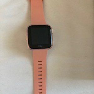 Rose Gold Fitbit versa with pink band